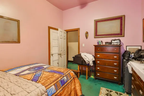 a bedroom with a bed and a closet