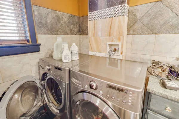 a utility room with dryer and washer