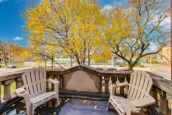 a view of a backyard with wooden fence