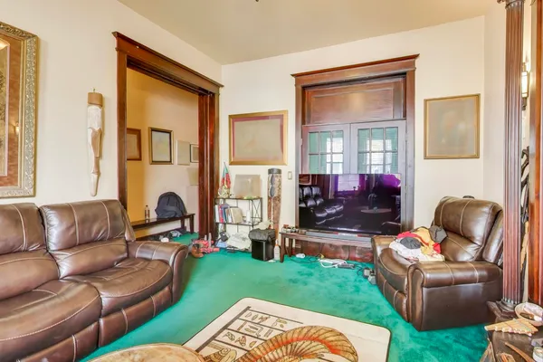 a living room with furniture and a fireplace