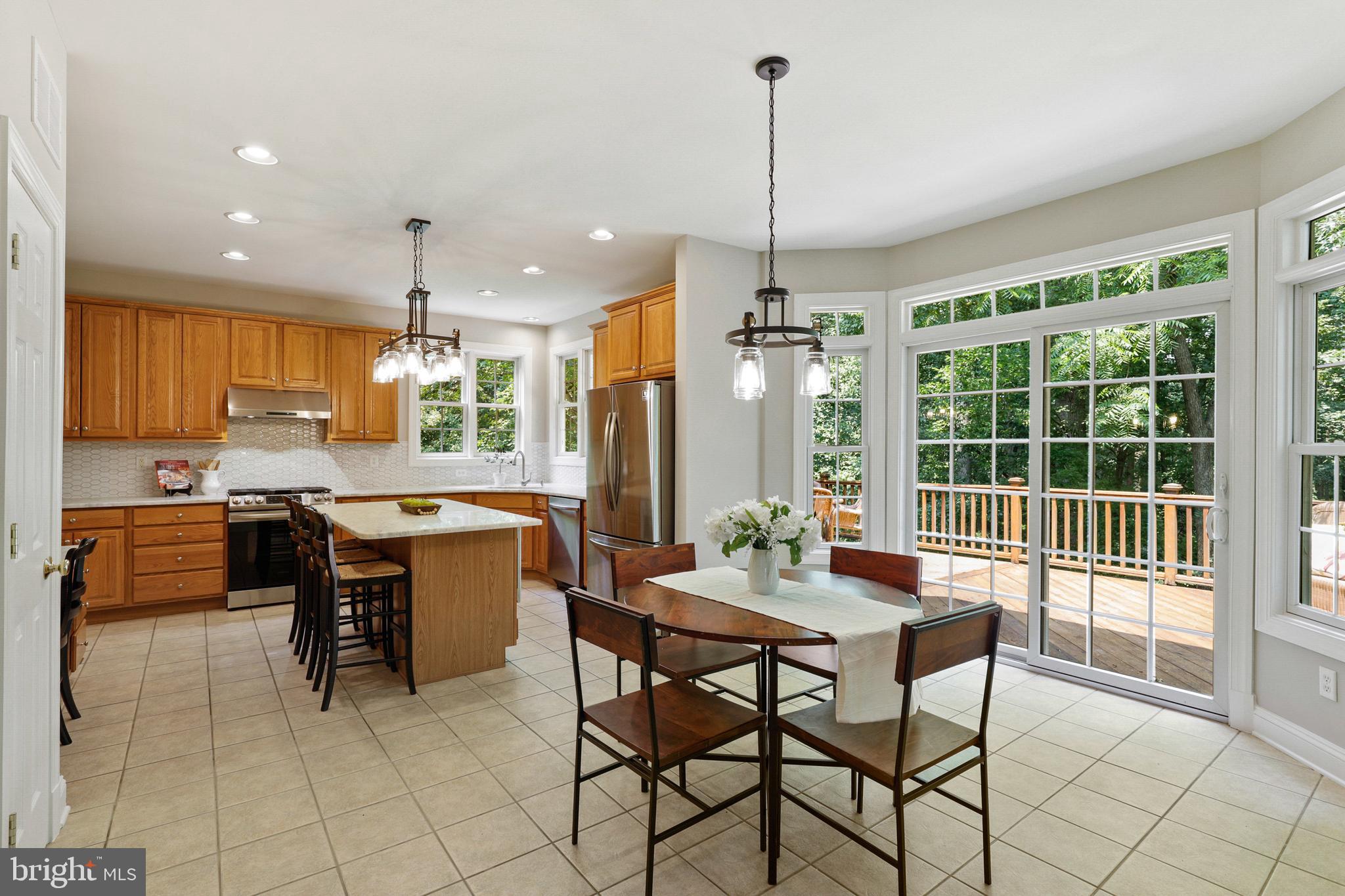 10181 Deep Skies Drive Laurel, MD 20723 - Photo 16 of 62 Breakfast area with sliders to custom-built deck