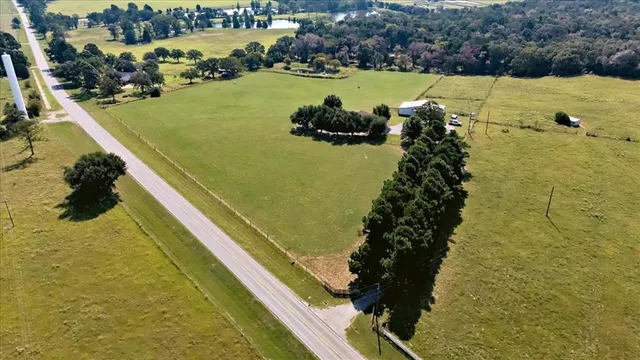 a view of a swimming pool with a yard