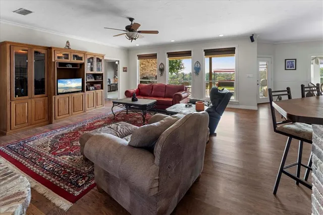 a living room with furniture a fireplace and a table