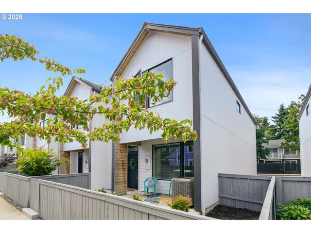 a view of a house with a flower garden