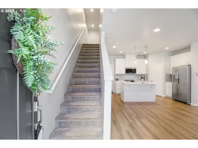 a view of kitchen with cabinets and wooden floor