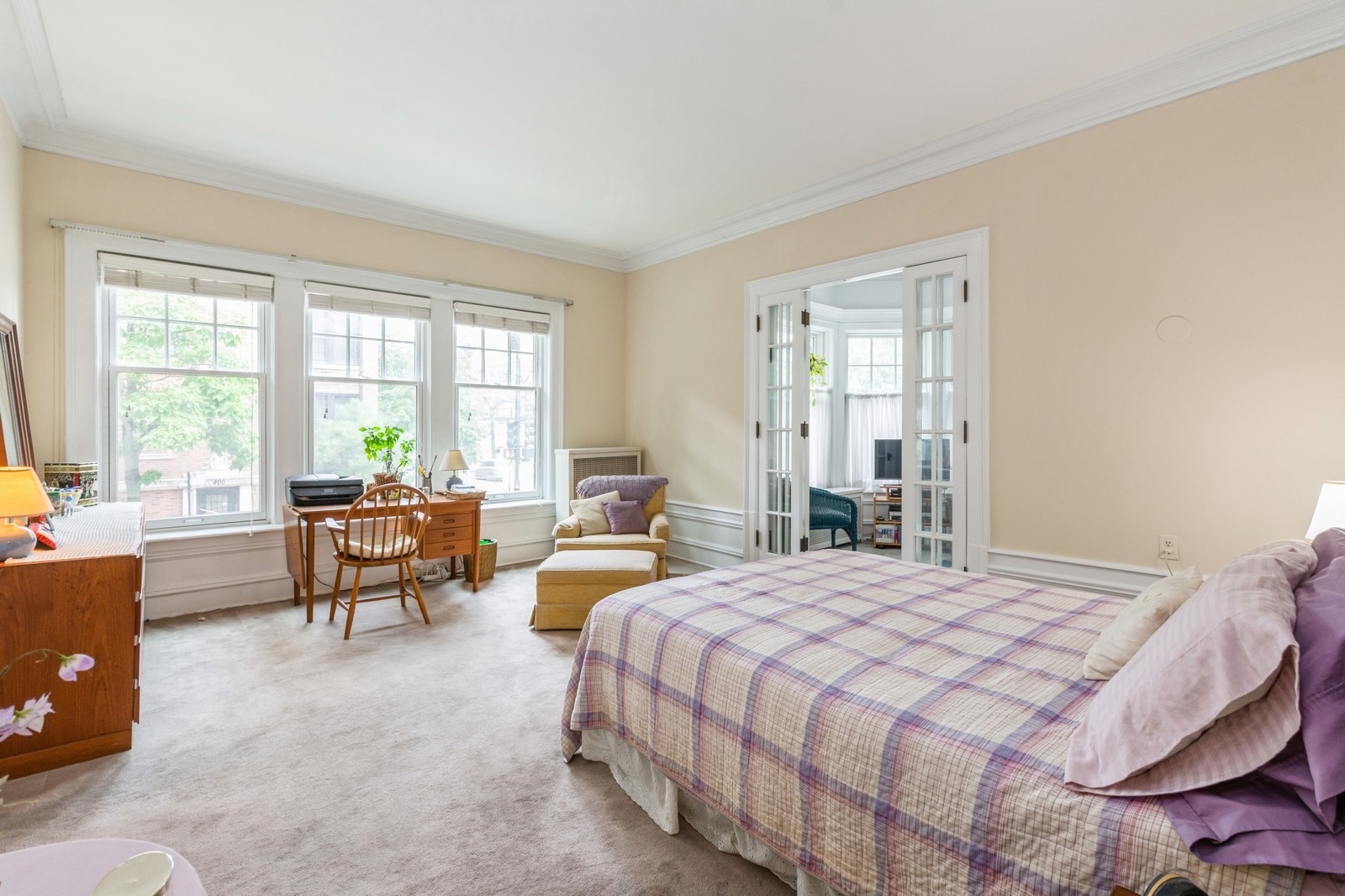 3122 North Sheridan Road, Unit 1B Chicago, IL 60657 - Photo 10 of 16 a bedroom with a bed and a couch next to a window