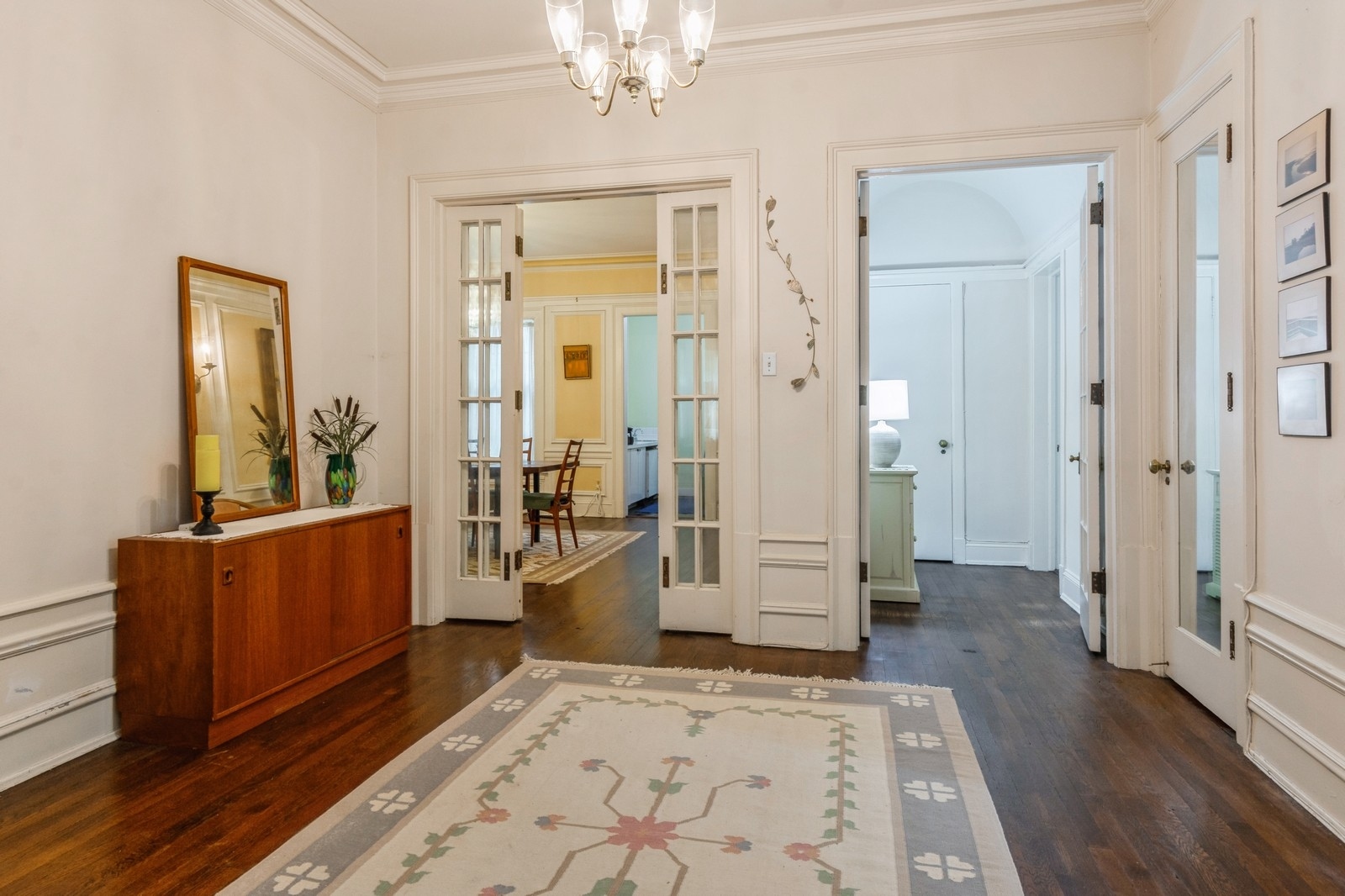 3122 North Sheridan Road, Unit 1B Chicago, IL 60657 - Photo 2 of 16 wooden floor and windows in a spacious bedroom
