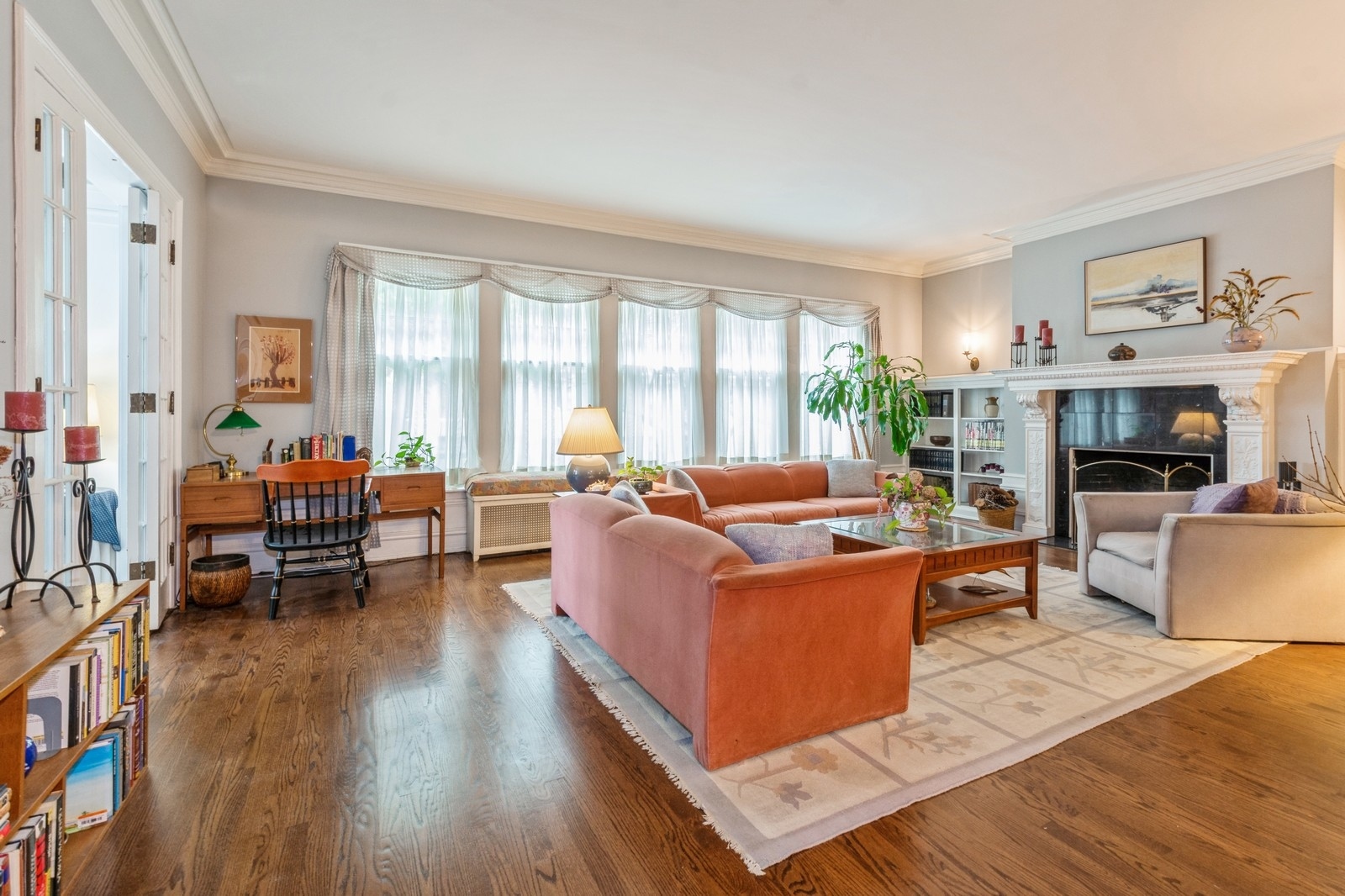 3122 North Sheridan Road, Unit 1B Chicago, IL 60657 - Photo 3 of 16 a living room with furniture and a fireplace