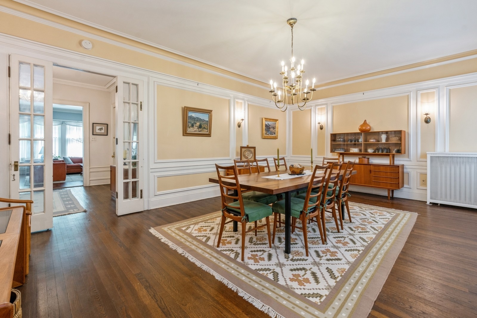3122 North Sheridan Road, Unit 1B Chicago, IL 60657 - Photo 5 of 16 a view of a dining room with furniture and wooden floor