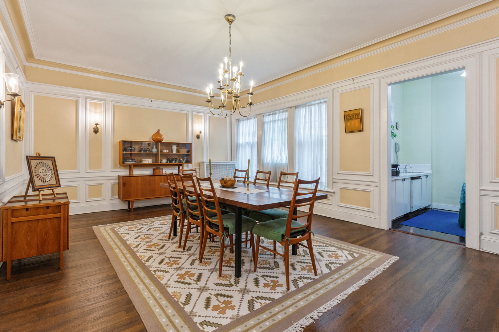 3122 North Sheridan Road, Unit 1B Chicago, IL 60657 - Photo 6 of 16 a view of a dining room with furniture window and wooden floor