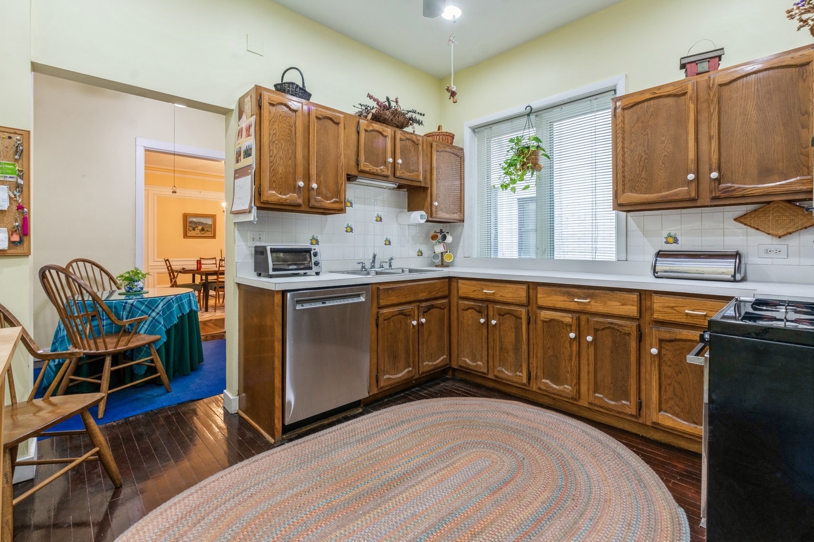 3122 North Sheridan Road, Unit 1B Chicago, IL 60657 - Photo 8 of 16 a kitchen with stainless steel appliances granite countertop a sink and cabinets