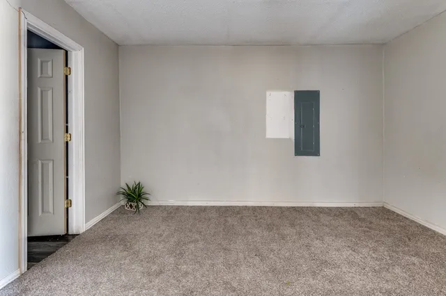 an empty room with a bench