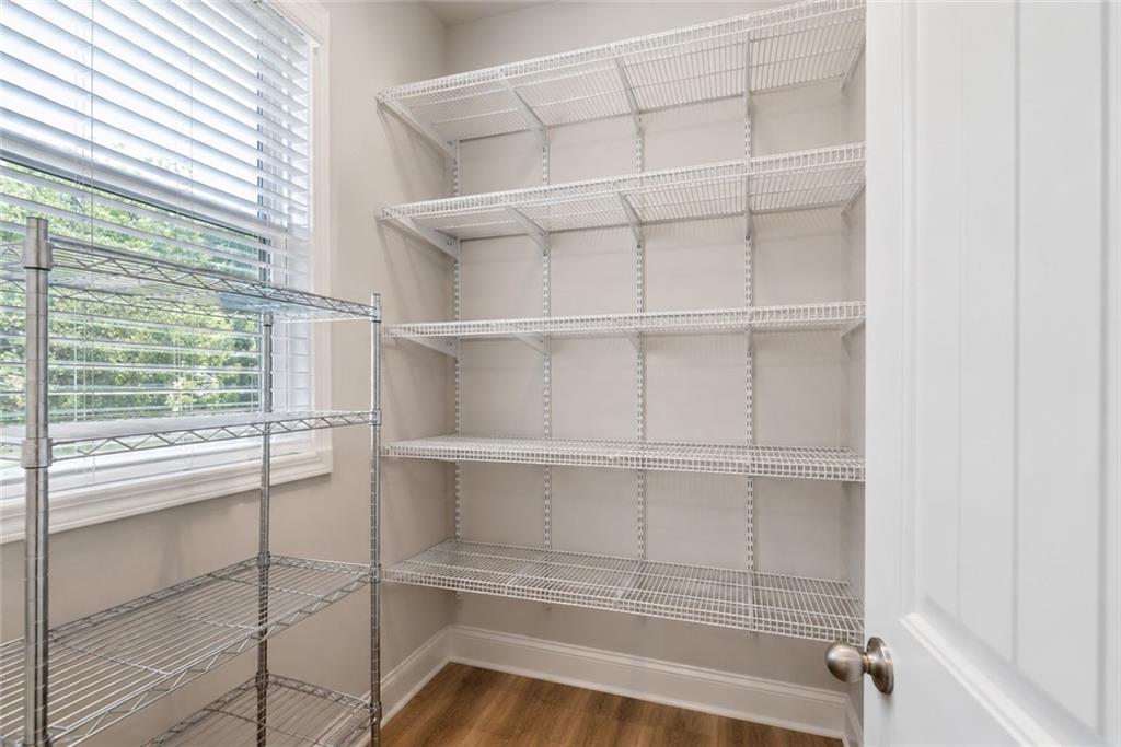 3334 Swallowtail Terrace Duluth, GA 30096 - Photo 26 of 37 a view of a room with rack on the wall and a window