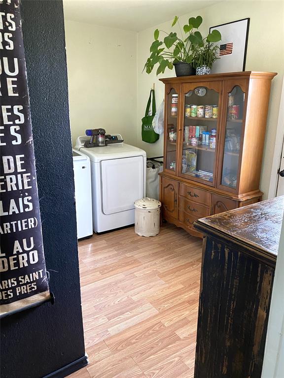 321 School House Road Paradise, TX 76073 - Photo 13 of 18 a kitchen with a stove a sink and a wooden floor