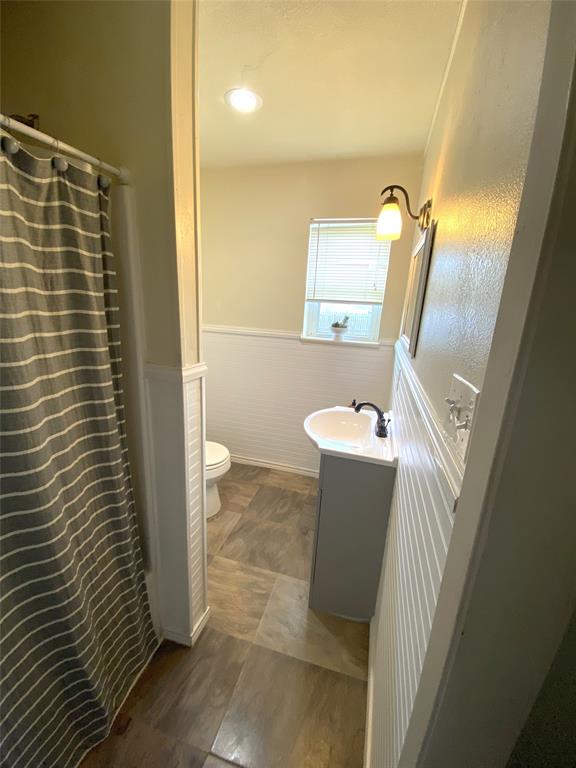 321 School House Road Paradise, TX 76073 - Photo 16 of 18 a bathroom with a sink and mirror