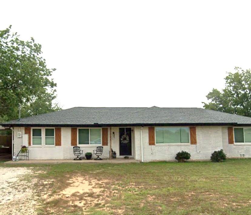 321 School House Road Paradise, TX 76073 - Photo 18 of 18 a view of a house with a swimming pool and a yard
