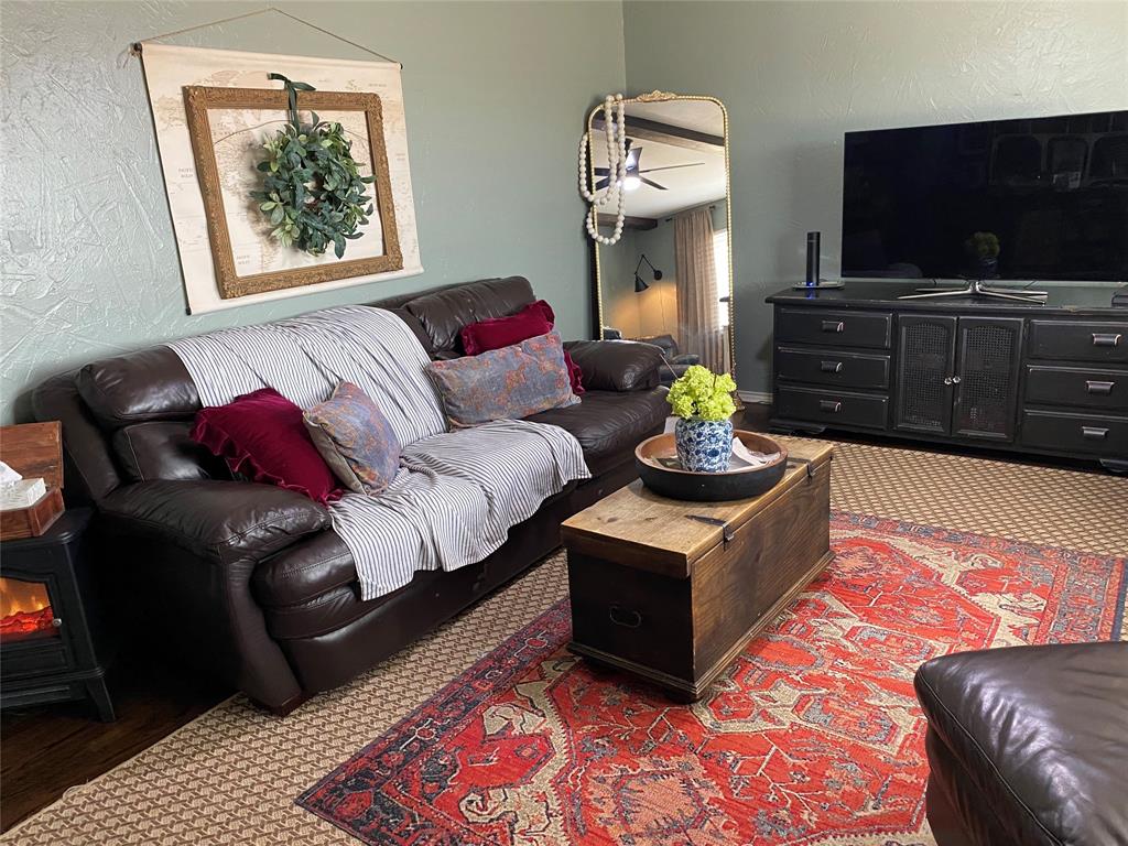 321 School House Road Paradise, TX 76073 - Photo 3 of 18 a living room with furniture and a flat screen tv