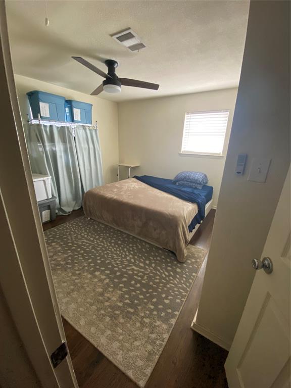321 School House Road Paradise, TX 76073 - Photo 5 of 18 a bed sitting in a room next to a window