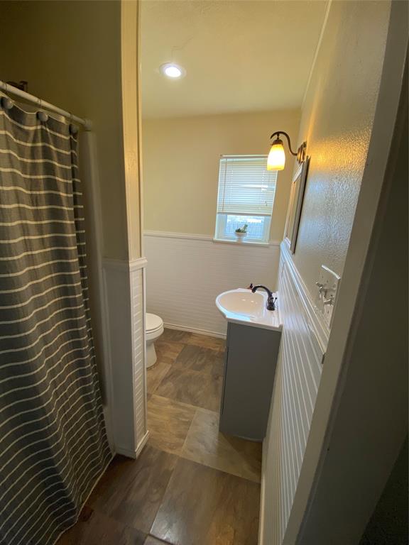 321 School House Road Paradise, TX 76073 - Photo 8 of 18 a bathroom with a sink and mirror
