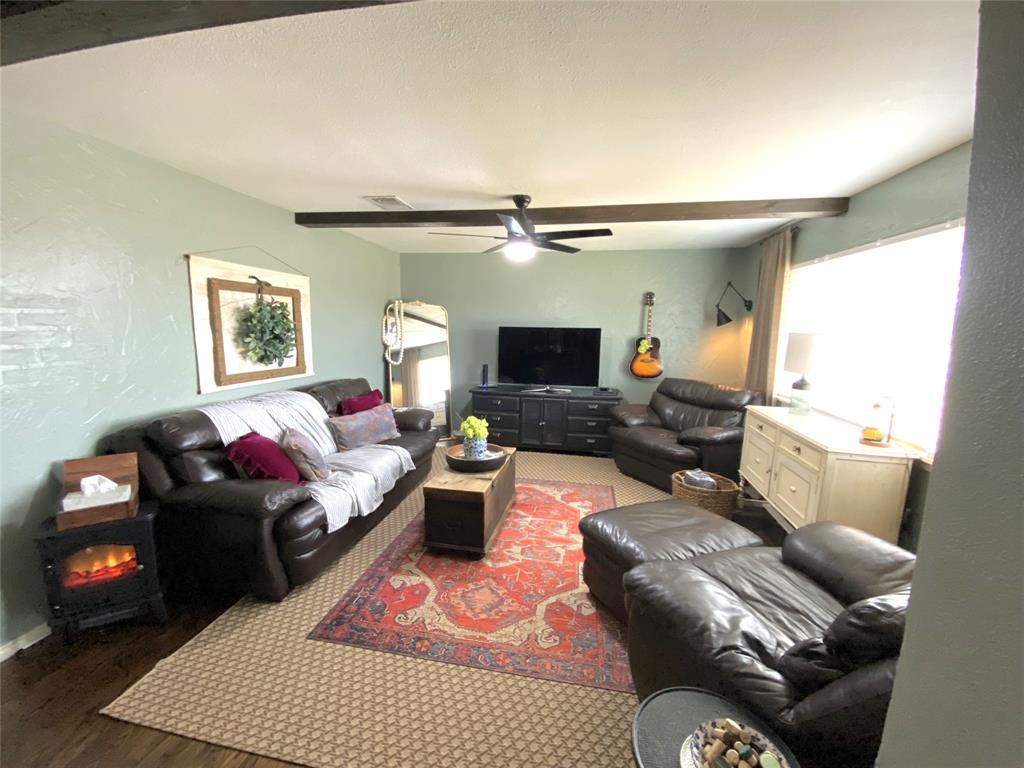 321 School House Road Paradise, TX 76073 - Photo 10 of 18 a living room with furniture and a flat screen tv