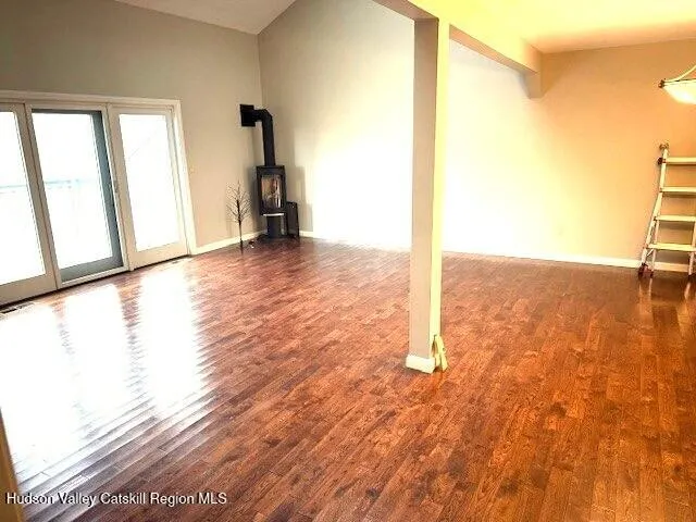a view of a kitchen with a sink and a refrigerator