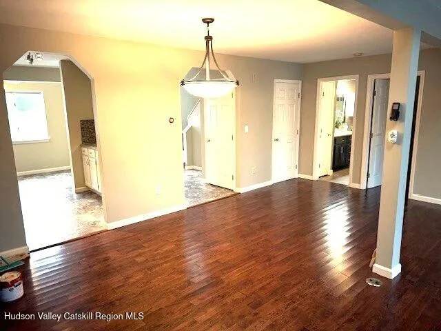 a kitchen with a refrigerator a stove a microwave and cabinets