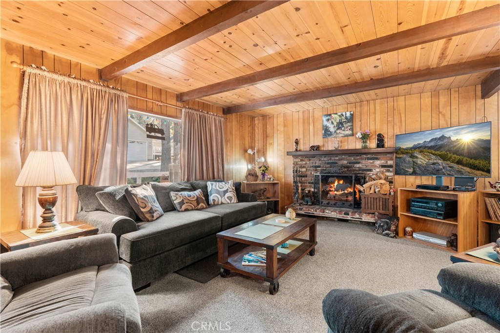 1130 Robin Road Wrightwood, CA 92397 - Photo 11 of 34 a living room with furniture and a fireplace