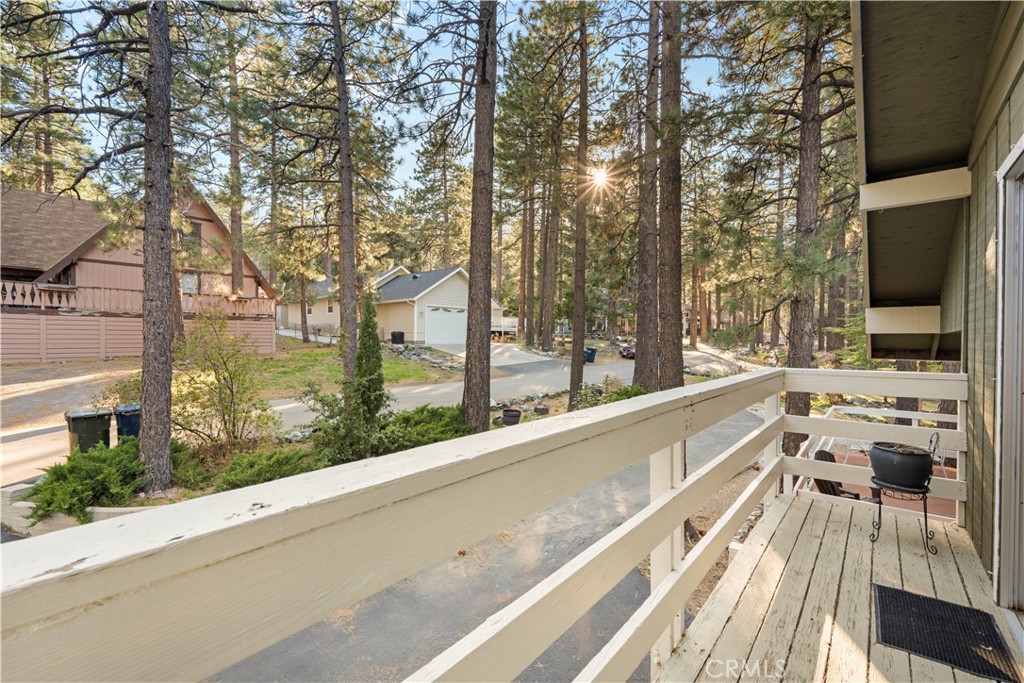 1130 Robin Road Wrightwood, CA 92397 - Photo 27 of 34 a view of a balcony with mountain view and wooden floor