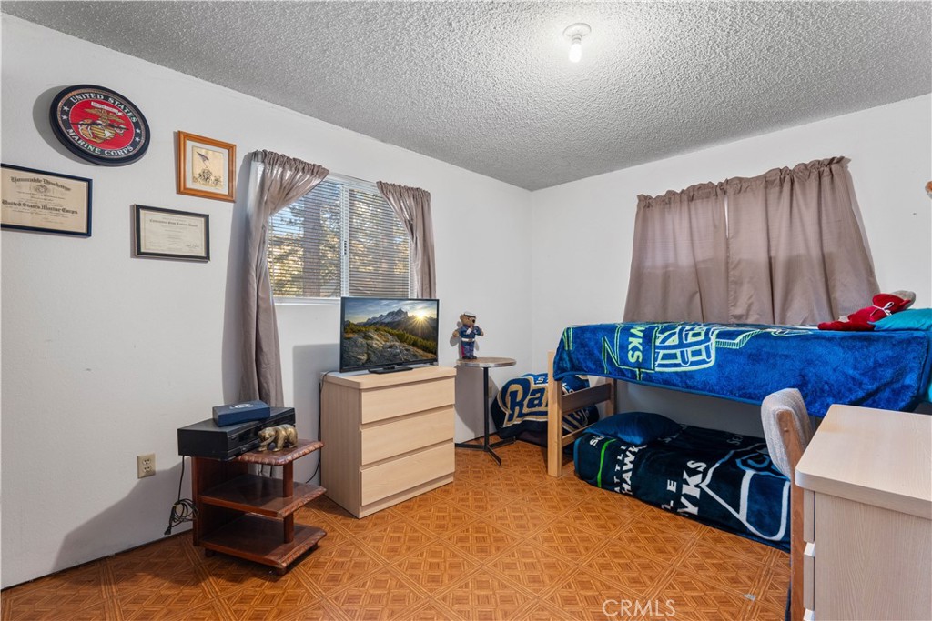 1130 Robin Road Wrightwood, CA 92397 - Photo 29 of 34 a bedroom with furniture and a window