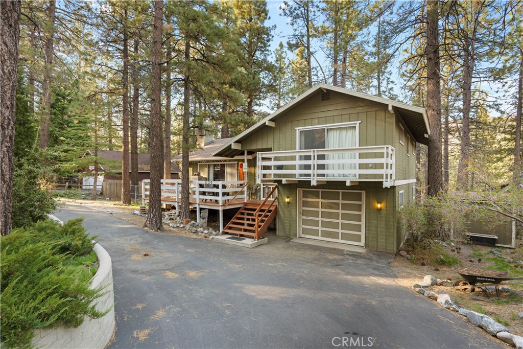 1130 Robin Road Wrightwood, CA 92397 - Photo 4 of 34 a view of a house with a yard and garage