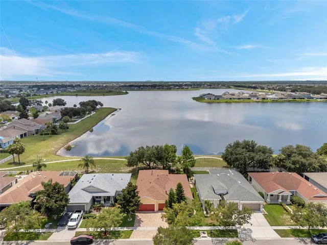 an aerial view of a city with ocean view