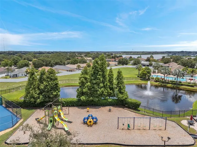 an aerial view of a house with a lake view