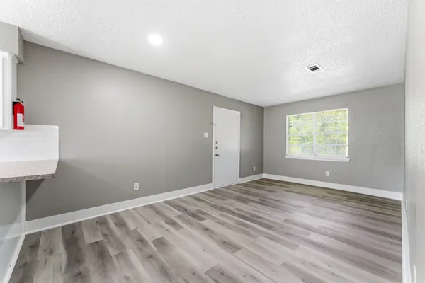 a view of an empty room with a window