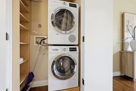 a view of a hallway with washer and dryer