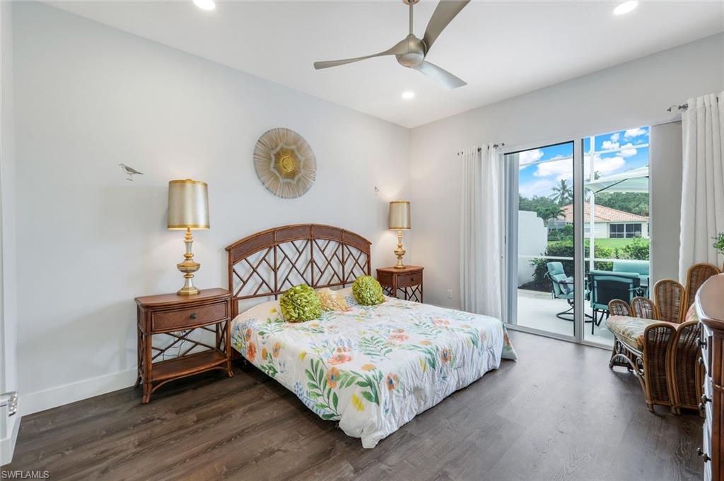 4648 Rio Poco Court Naples, FL 34109 - Photo 19 of 27 Master Bedroom with access to outside, finished floors, recessed lighting, baseboards, and ceiling fan