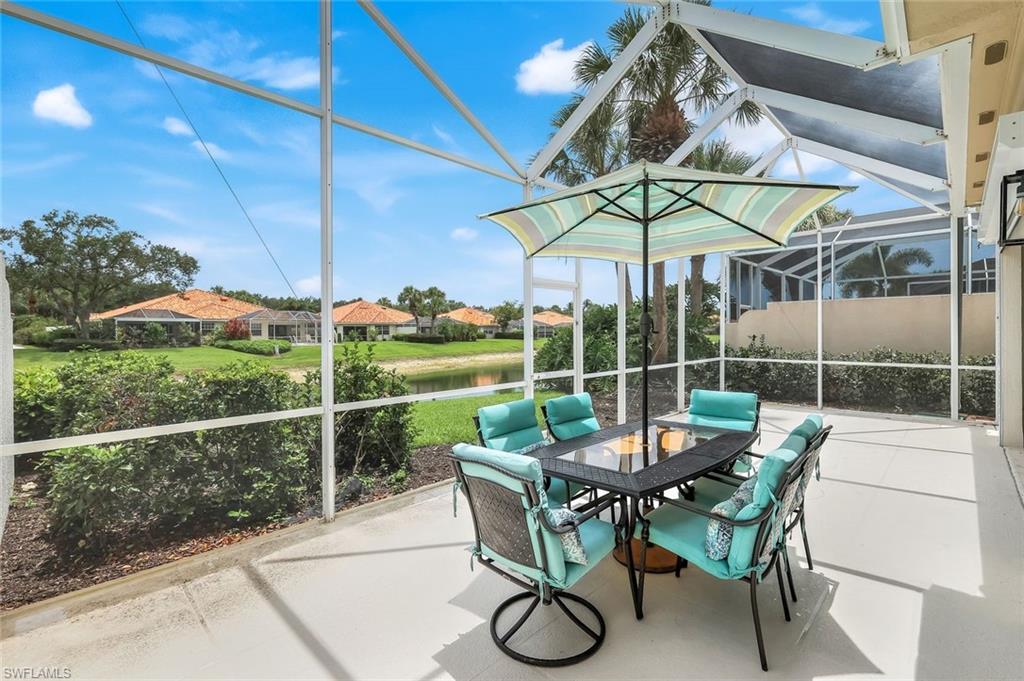 4648 Rio Poco Court Naples, FL 34109 - Photo 6 of 27 Lanai with a water view & outdoor dining. Lake is Extremely Low due to current drought!!!