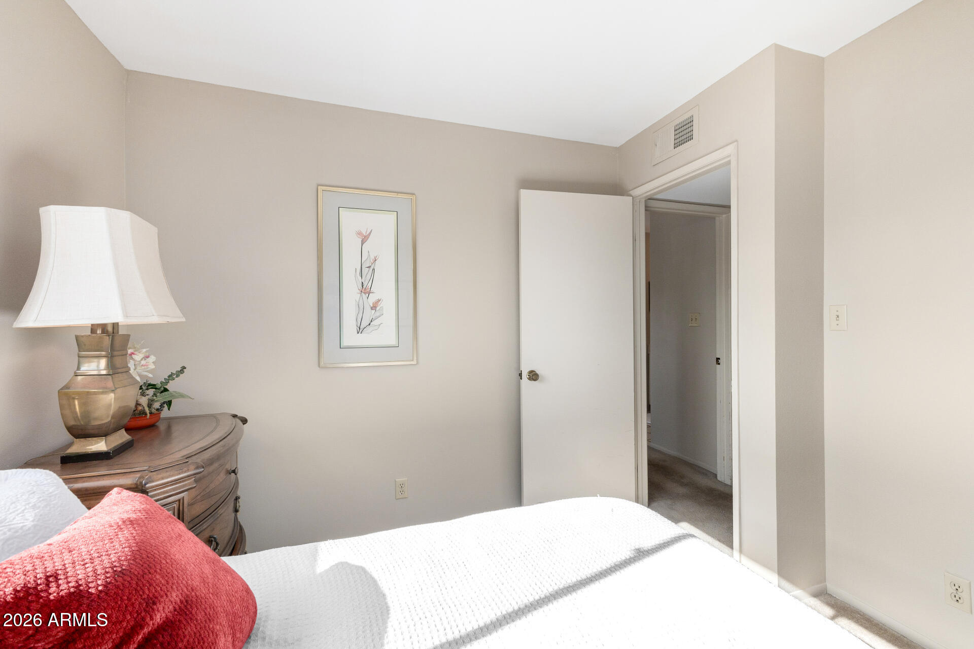 5525 East Thomas Road, Unit H7 Phoenix, AZ 85018 - Photo 17 of 27 a bedroom with a bed and a lamp