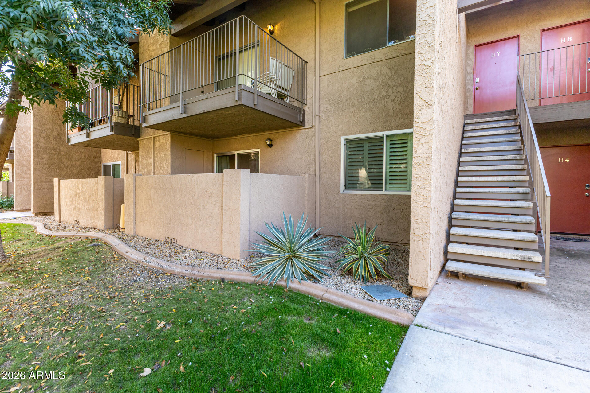 5525 East Thomas Road, Unit H7 Phoenix, AZ 85018 - Photo 2 of 27 a view of a house with a yard