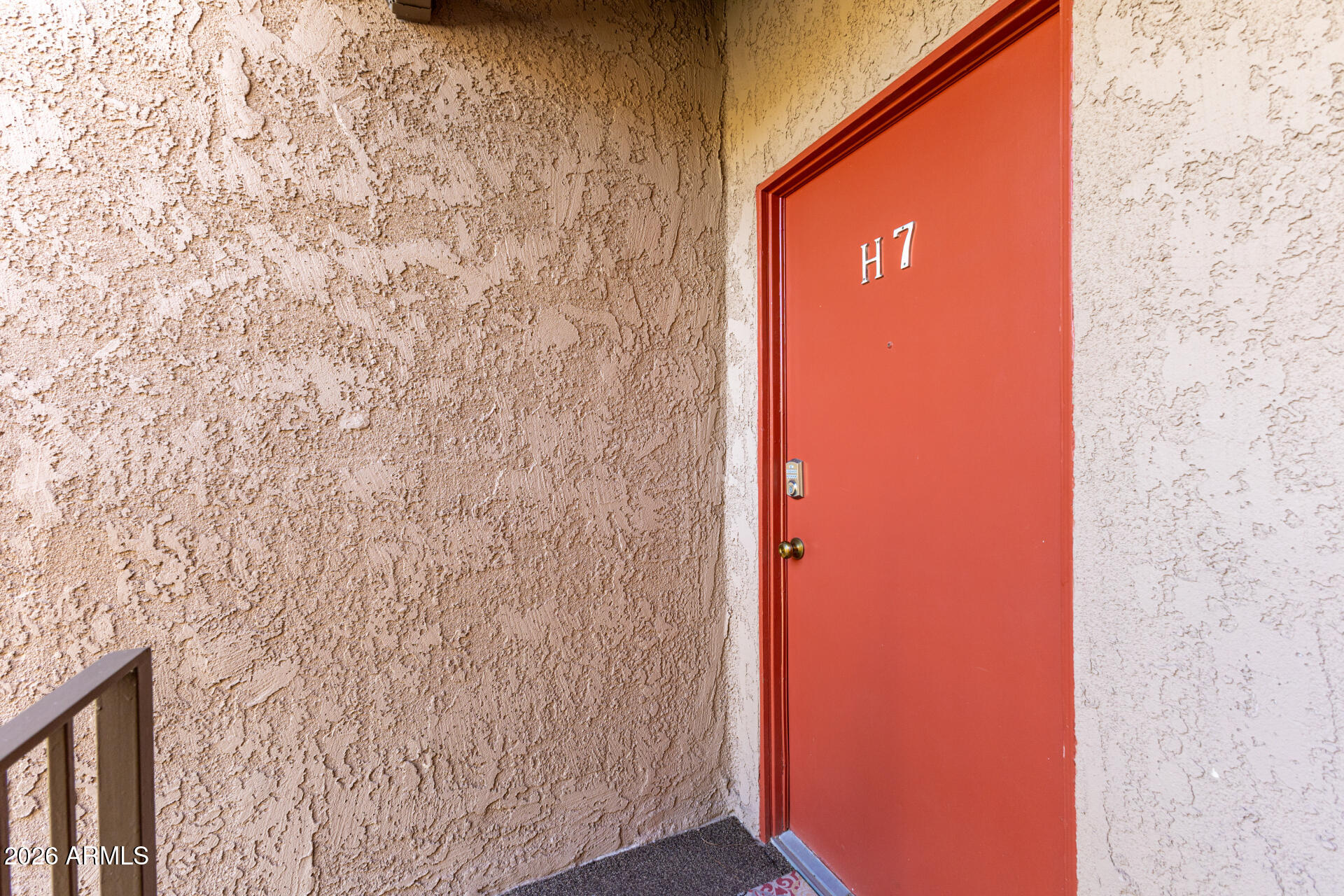 5525 East Thomas Road, Unit H7 Phoenix, AZ 85018 - Photo 3 of 27 a door with a tree