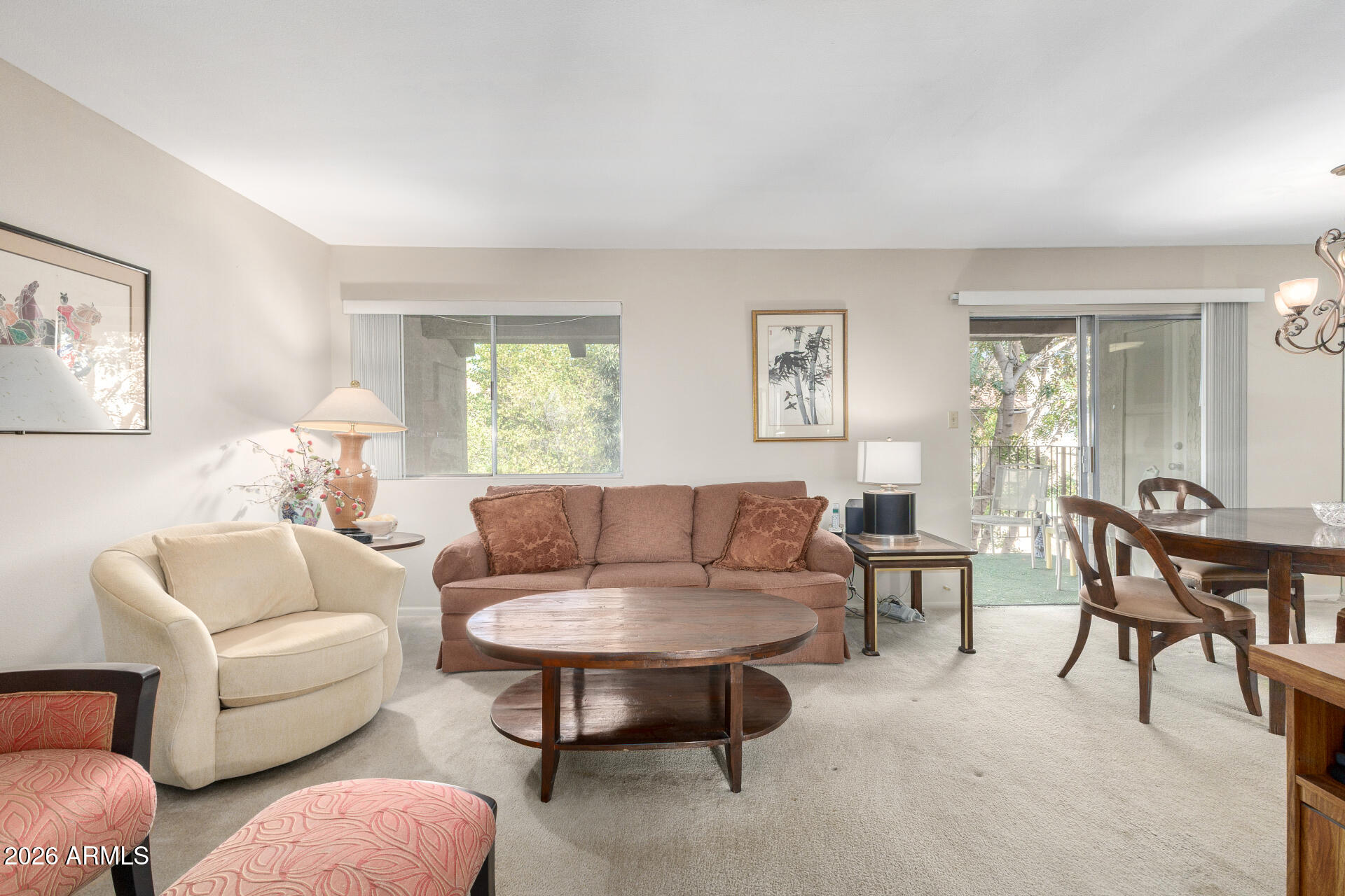 5525 East Thomas Road, Unit H7 Phoenix, AZ 85018 - Photo 5 of 27 a living room with furniture a rug and a window