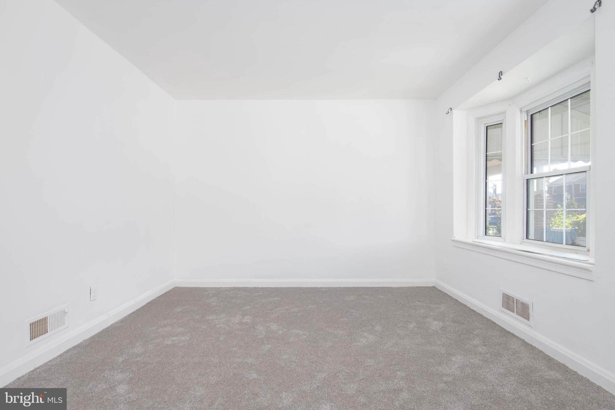 724 Middlesex Road Essex, MD 21221 - Photo 8 of 36 an empty room with a window