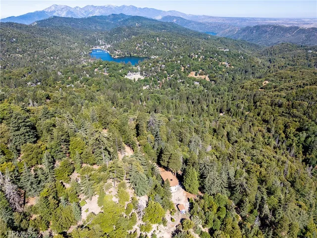 a view of a lush green hillside and a building