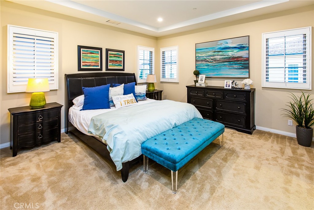 75 Gardenstone Path Irvine, CA 92620 - Photo 15 of 65 a bedroom with a bed and wooden floor