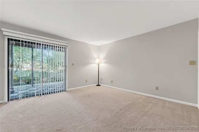 a view of a room with sliding glass door