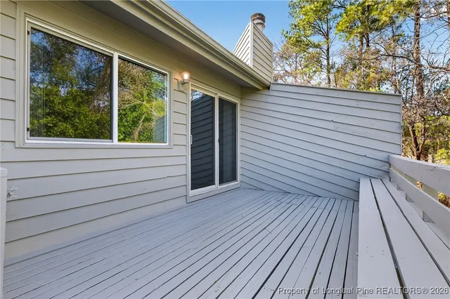a view of a wooden bench in a balcony