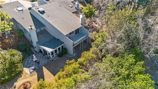 an aerial view of a house with outdoor space