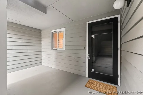 a view of a door and a window