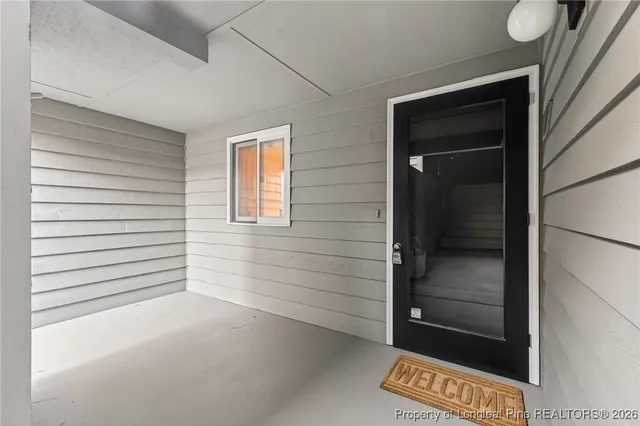 a view of a door and a window