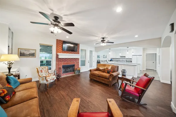 a dining room with furniture and chandelier