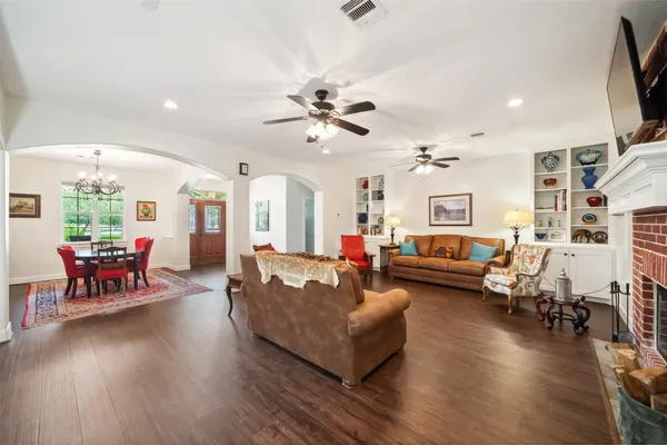 a bathroom with a double vanity sink and mirror with shower